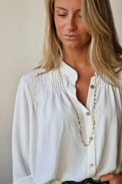 Blusa con botones blanco roto