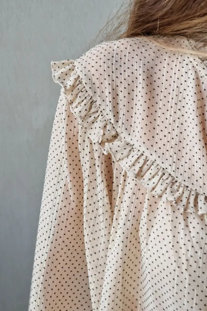 Blusa crudo tipo gasa con volante