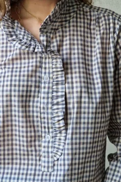 Blusa cuadros con volantes gris