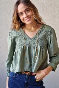 Blusa fruncida con hilo plateado verde militar