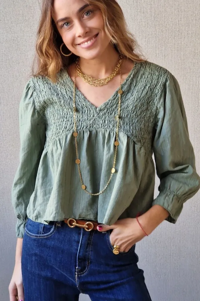 Blusa fruncida con hilo plateado verde militar