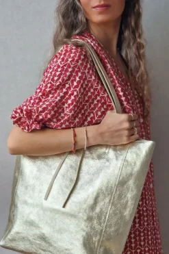 Bolso de piel dorado con opción de personalizar