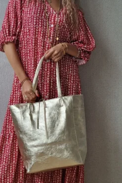 Bolso de piel dorado con opción de personalizar
