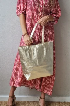 Bolso de piel dorado con opción de personalizar