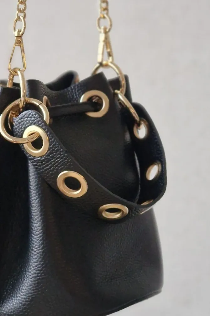 Bolso de piel tipo bombonera animal print