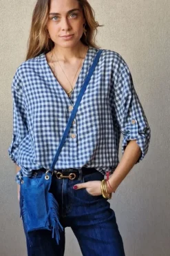 Bolso mini de ante y flecos azul