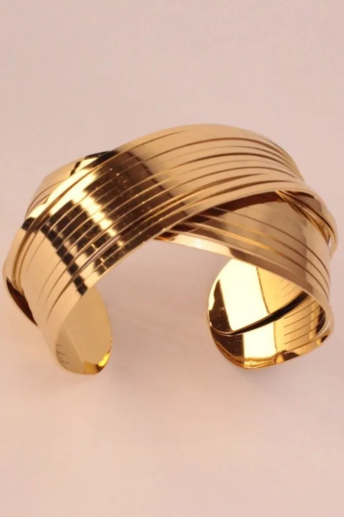 Brazalete acero cruzado Dorado