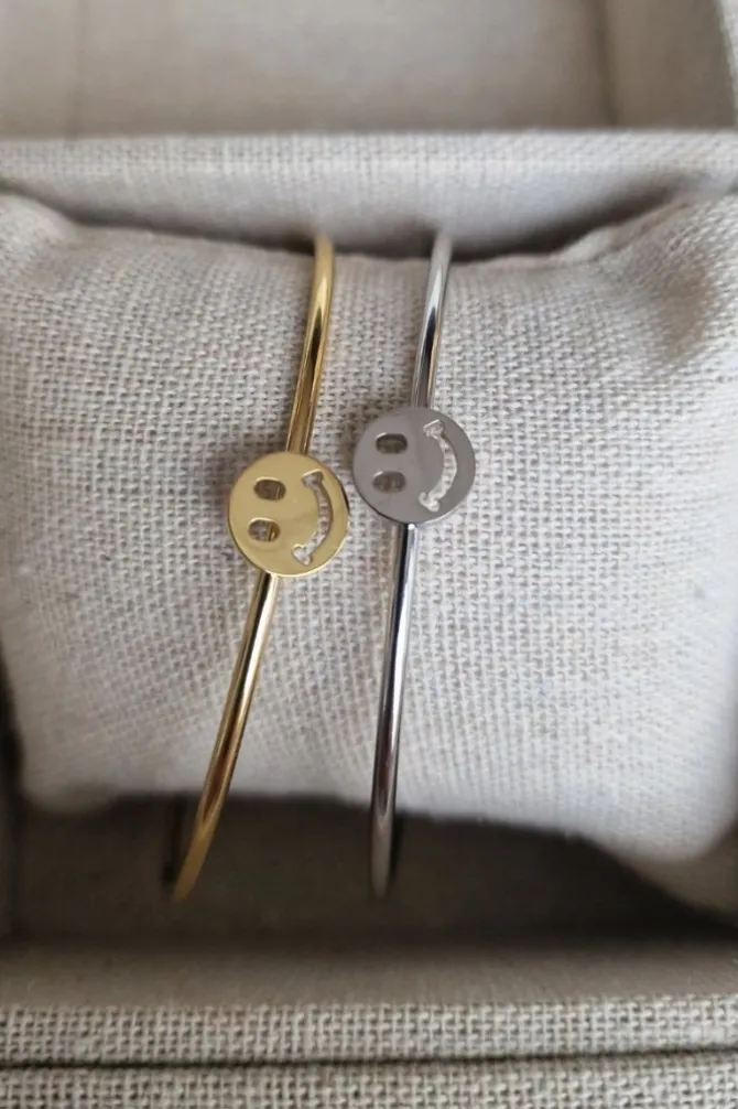 Brazalete de acero rígido fino carita feliz