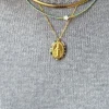 Collar chocker de acero dorado
