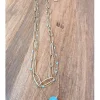 Gargantilla triple de acere dorado y piedras azules