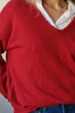 Jersey cuello pico con pespunte burdeos