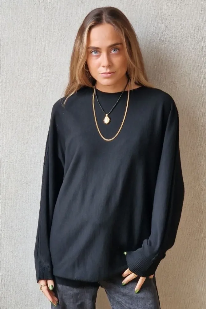Jersey oversize manga murciélago negro
