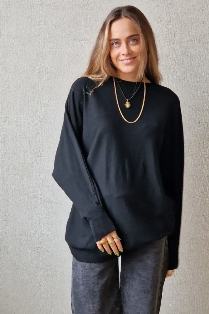 Jersey oversize manga murciélago negro