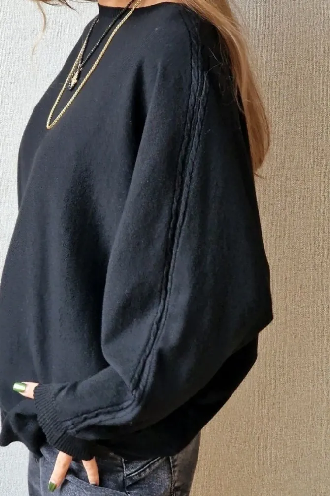 Jersey oversize manga murciélago negro