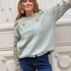 Jersey verde con flores doradas