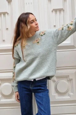 Jersey verde con flores doradas