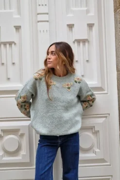 Jersey verde con flores doradas