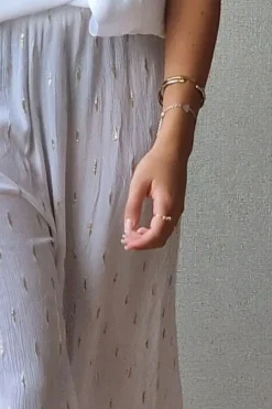 Pantalón tipo bambula blanco y lurex dorado