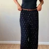 Pantalón tipo bambula negro y lurex dorado