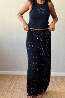 Pantalón tipo bambula negro y lurex dorado