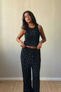Pantalón tipo bambula negro y lurex dorado