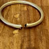 Pulseras rígida de acero con piedra marrón