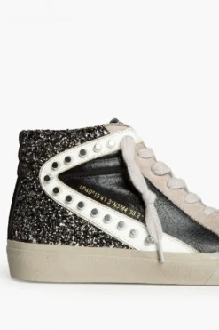 Sneakers negras con detalle blanco, glitter y tachuelas