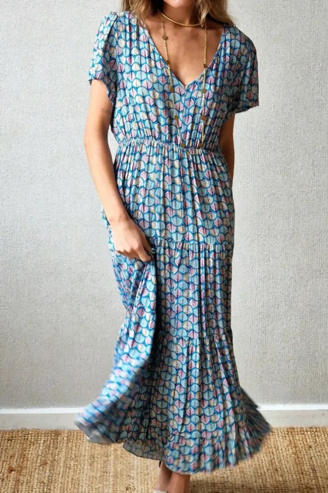 Vestido largo con pico y volantes estampado azul